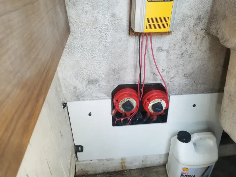 Slide: The Image of Electrical setup in a 1977 Pace Wahoo boat with battery switches and wiring. - 5