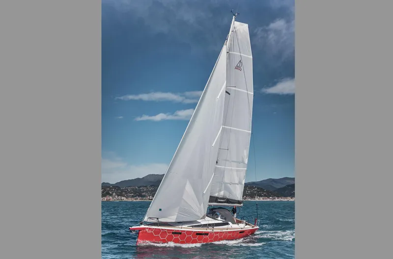 Slide: The Image of 2025 Dehler 38 SQ sailboat with red hull sailing on a sunny day. - 32