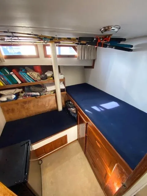 Slide: The Image of Interior of 1973 Uniflite 42 Flybridge with storage and fishing rods. - 22