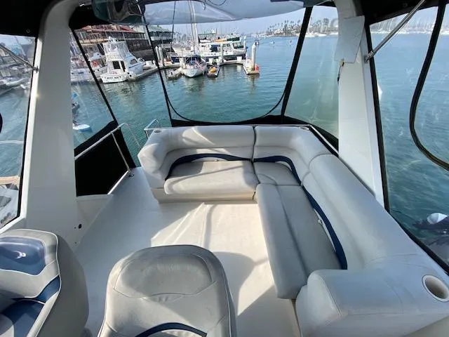 Slide: The Image of 1973 Uniflite 42 Flybridge with spacious seating overlooking marina. - 25