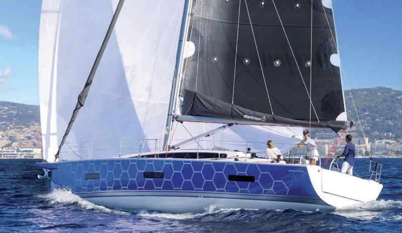 The Image of 2025 Dehler 46 sailboat cruising on the ocean with crew onboard. - 0