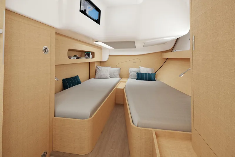 Slide: The Image of Luxurious interior of 2026 Dehler 46SQ yacht with elegant dining area and cozy cabin. - 30
