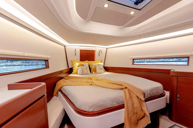 Slide: The Image of 2026 Dehler 46SQ yacht sailing on open water with scenic mountain backdrop. - 41