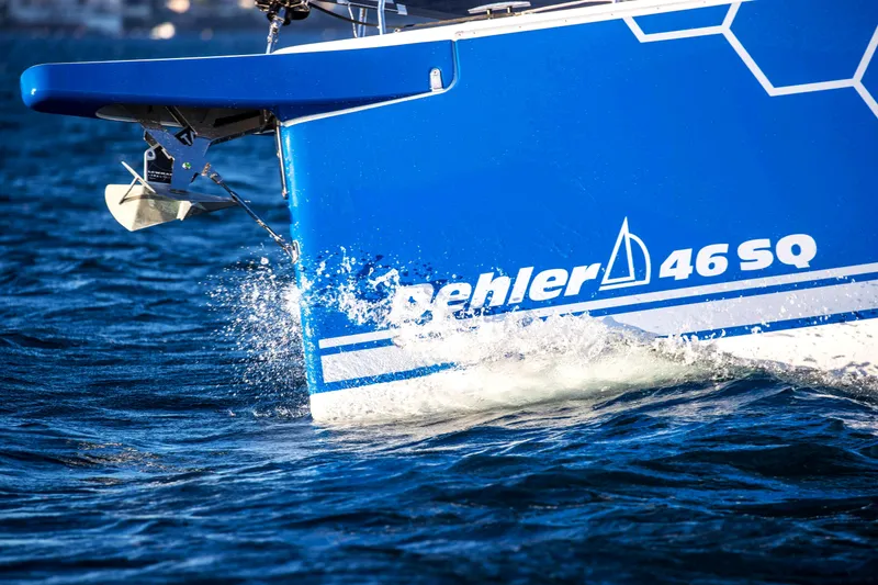 Slide: The Image of 2026 Dehler 46SQ sailboat navigating open waters under clear blue skies. - 46