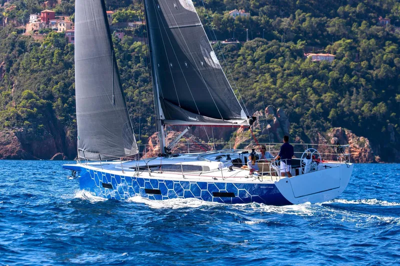 Slide: The Image of Woman sailing on 2026 Dehler 46SQ yacht, enjoying the ocean view. - 48
