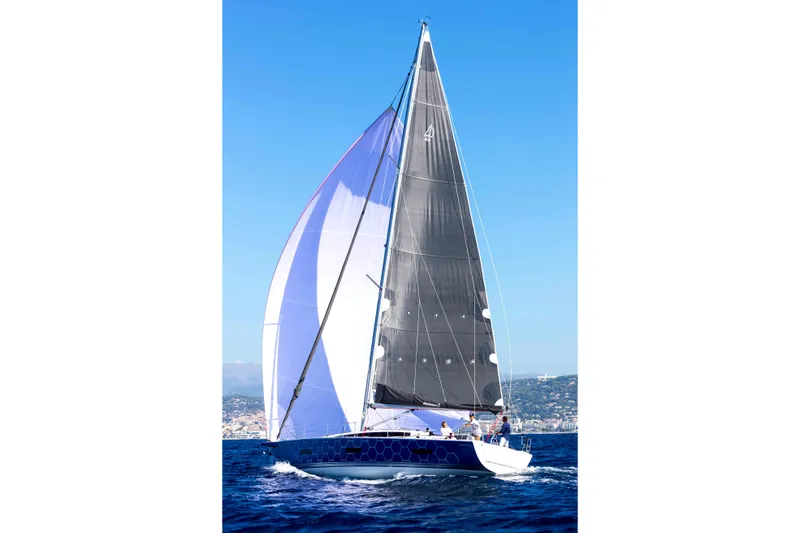 Slide: The Image of Couple relaxing on a 2026 Dehler 46SQ sailboat, enjoying serene waters. - 52