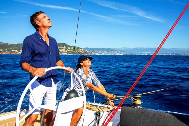 Slide: The Image of Couple enjoying breakfast on a 2026 Dehler 46SQ yacht, with scenic ocean view. - 55