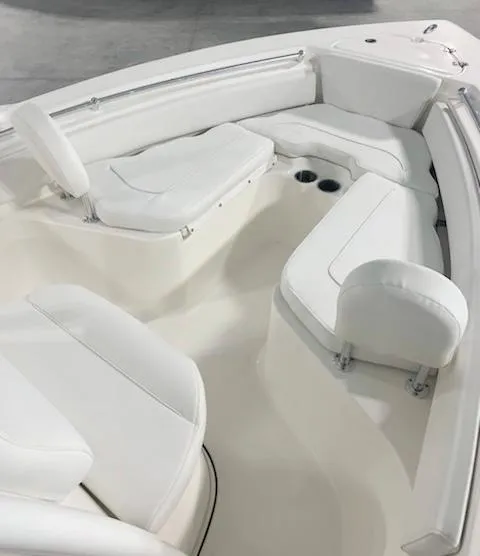 Slide: The Image of 2024 Key West 219 FS boat interior with white cushioned seating - 3