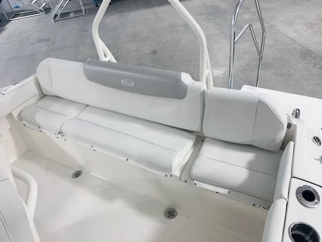 Slide: The Image of 2024 Key West 219 FS boat interior with white cushioned seating. - 6