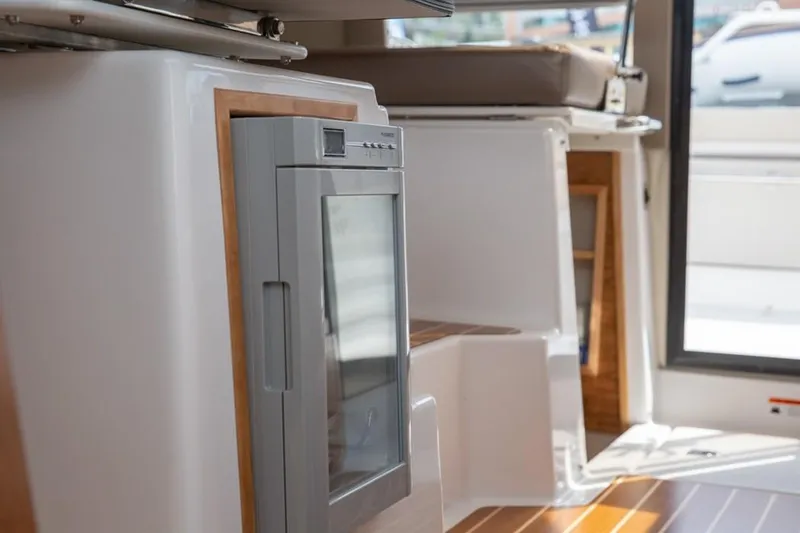 Slide: The Image of 2020 Cutwater C 32 CB interior with modern appliances and sleek design. - 10