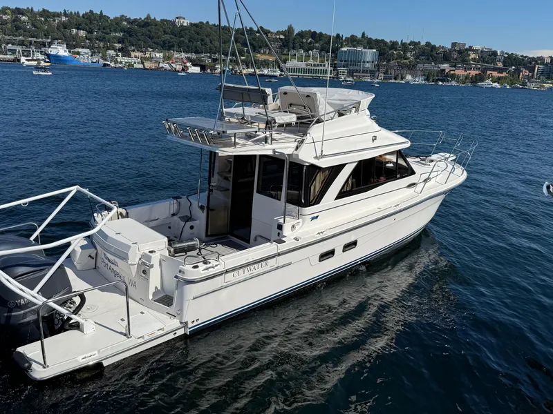 Slide: The Image of 2020 Cutwater C 32 CB boat on water, scenic background, sunny day. - 3