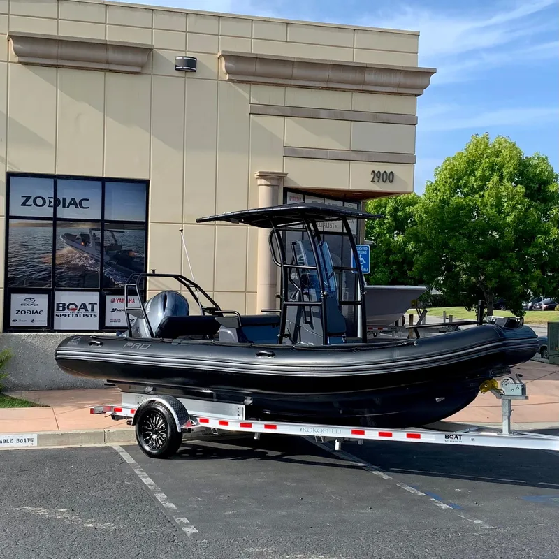The Image of 2023 Zodiac Pro 6.5 boat on trailer outside dealership. - 0