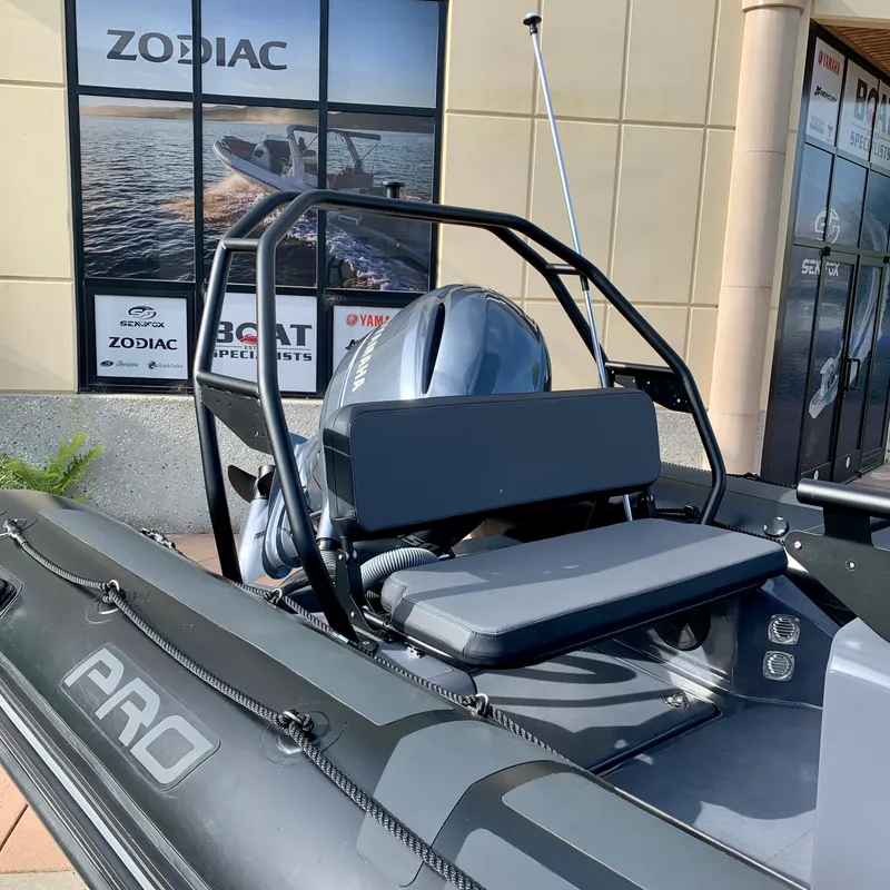 Slide: The Image of 2023 Zodiac Pro 6.5 boat displayed at dealership with Yamaha engine. - 5