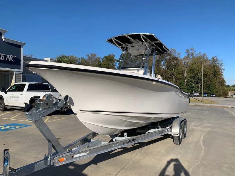 The Image of 2024 Key West 239 FS boat on a trailer in a parking lot. - 0