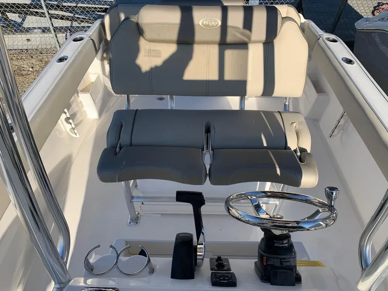 Slide: The Image of 2024 Key West 239 FS boat cockpit with dual seats and steering console. - 11