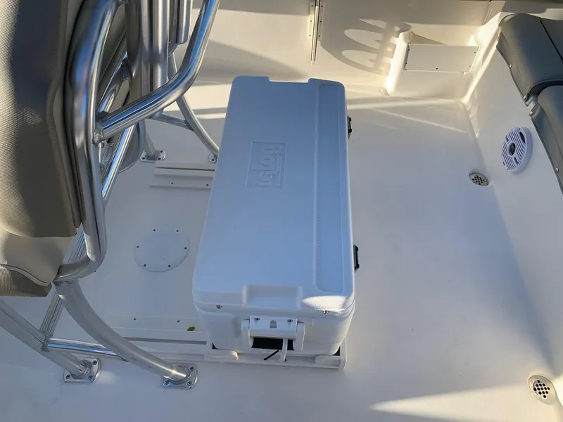 Slide: The Image of 2024 Key West 239 FS boat interior with cooler and seating. - 3