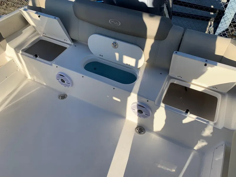 Slide: The Image of 2024 Key West 239 FS boat interior with storage compartments and seating. - 5