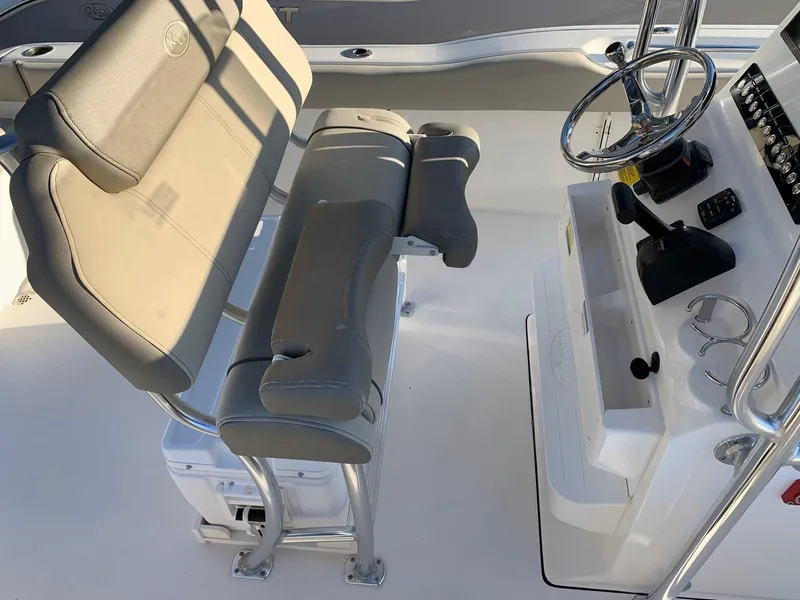 Slide: The Image of 2024 Key West 239 FS boat interior with helm and seating. - 9