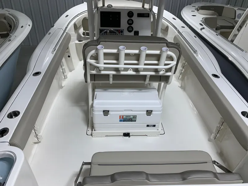Slide: The Image of 2024 Key West 244 Center Console boat interior with seating and storage. - 2