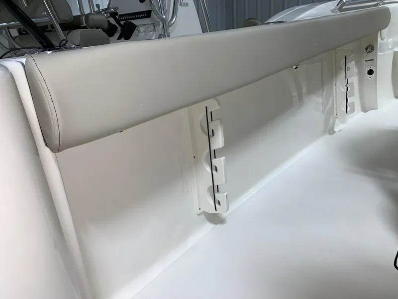 Slide: The Image of 2024 Key West 244 Center Console interior side view with cushioned rail. - 3