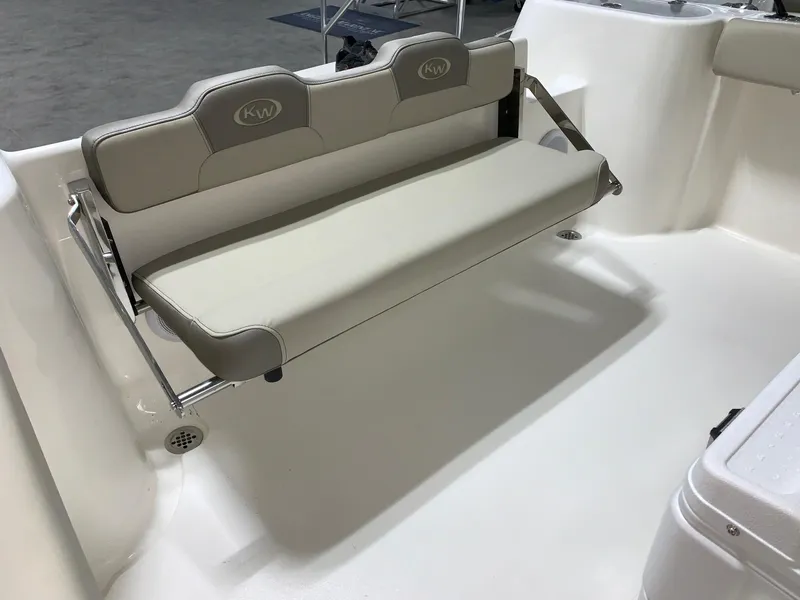 Slide: The Image of 2024 Key West 244 Center Console boat with foldable rear bench seat. - 5
