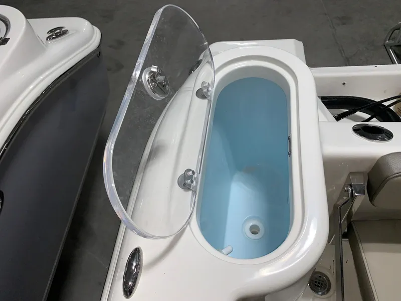 Slide: The Image of 2024 Key West 244 Center Console livewell with open lid. - 6