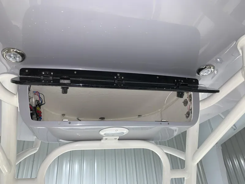 Slide: The Image of 2024 Key West 244 Center Console boat interior detail with open compartment. - 8