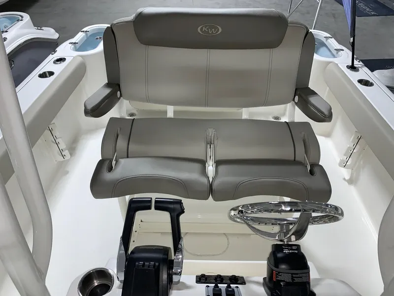 Slide: The Image of 2024 Key West 244 Center Console boat helm with dual seating and steering wheel. - 10