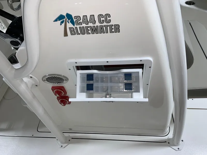Slide: The Image of 2024 Key West 244 Center Console Bluewater storage compartment. - 12