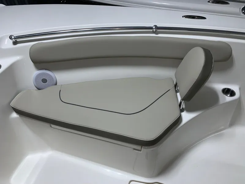 Slide: The Image of 2024 Key West 244 Center Console boat with cushioned seating and backrest. - 15