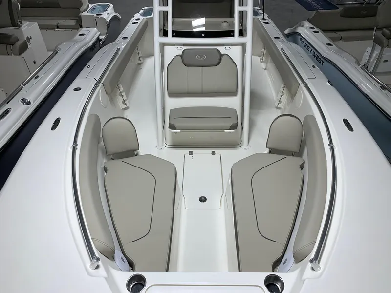 Slide: The Image of 2024 Key West 244 Center Console boat interior with cushioned seating. - 16