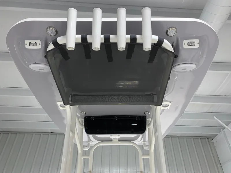 Slide: The Image of 2024 Key West 244 Center Console T-top with rod holders and storage net. - 4