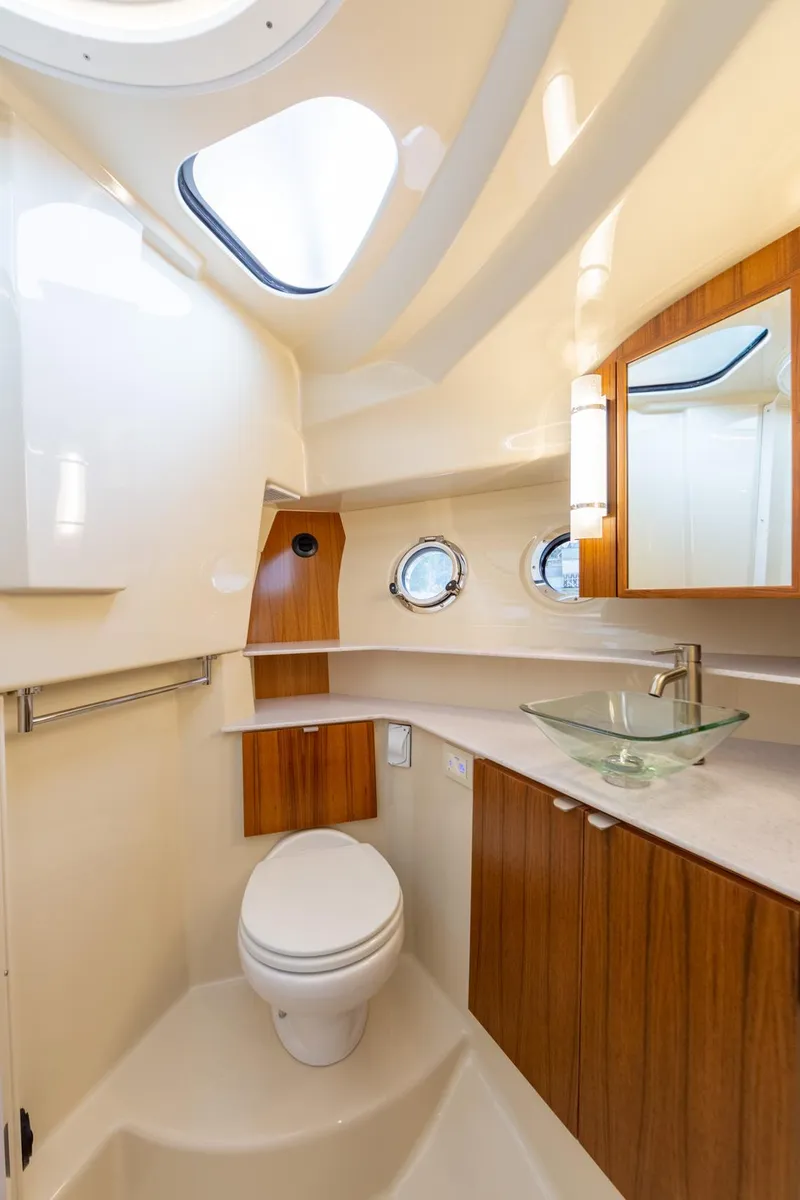 Slide: The Image of Luxurious bathroom in 2025 Ranger Tugs R-43 Command Bridge yacht, featuring modern fixtures and elegant design. - 19