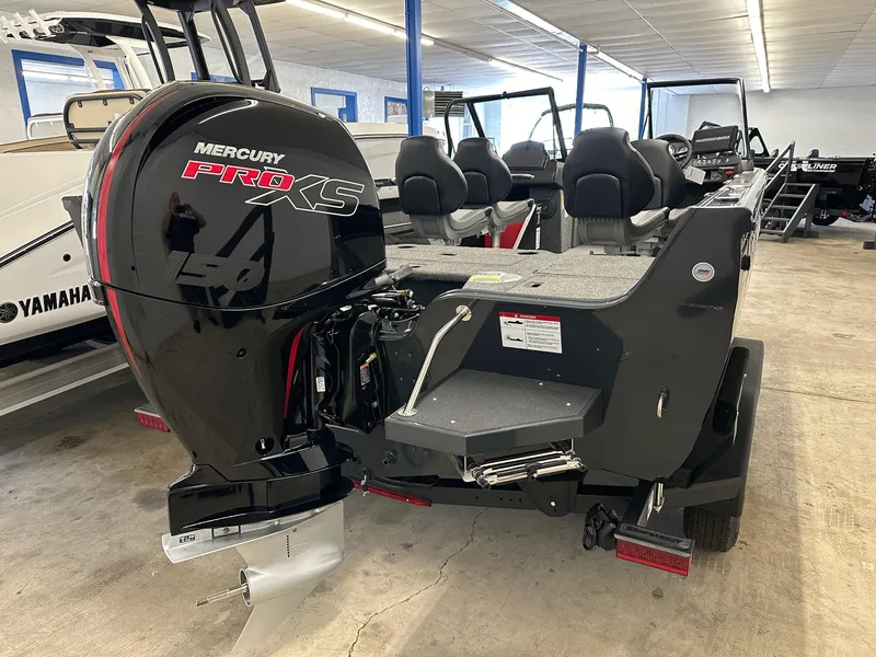 Slide: The Image of 2025 Crestliner 1950 Super Hawk boat with Mercury Pro XS engine in showroom. - 2