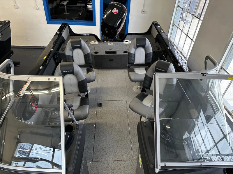 Slide: The Image of 2025 Crestliner 1950 Super Hawk boat interior with seating and windshield. - 4