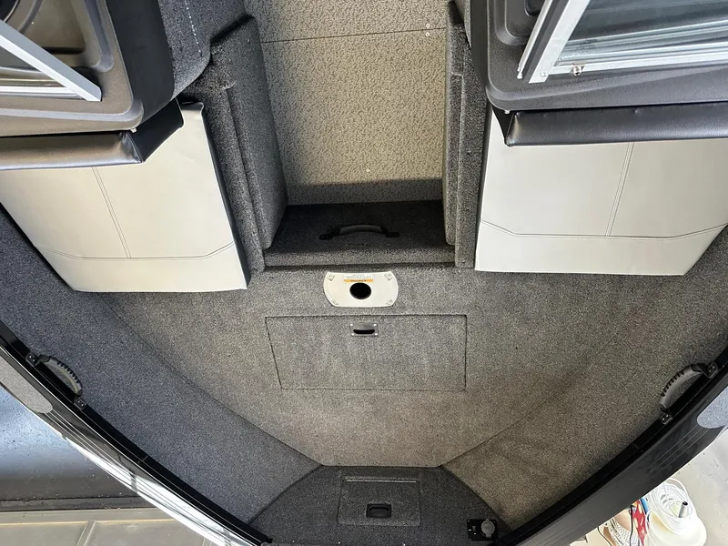 Slide: The Image of Interior view of 2025 Crestliner 1950 Super Hawk boat with carpeted flooring. - 6