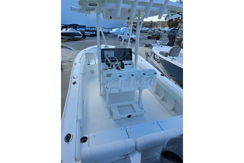 Slide: The Image of 2019 Sea Hunt Ultra 211 boat interior with steering console and seating. - 12