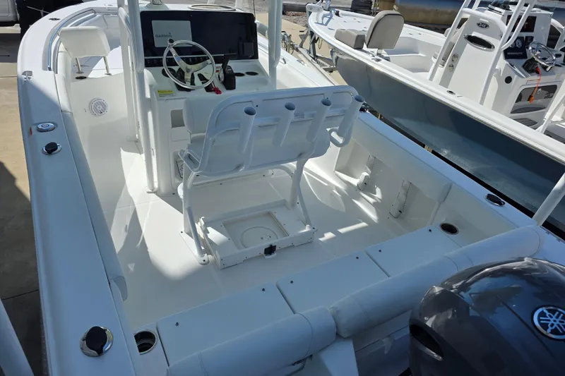 Slide: The Image of Interior of a 2019 Sea Hunt Ultra 211 boat, white cockpit. - 7