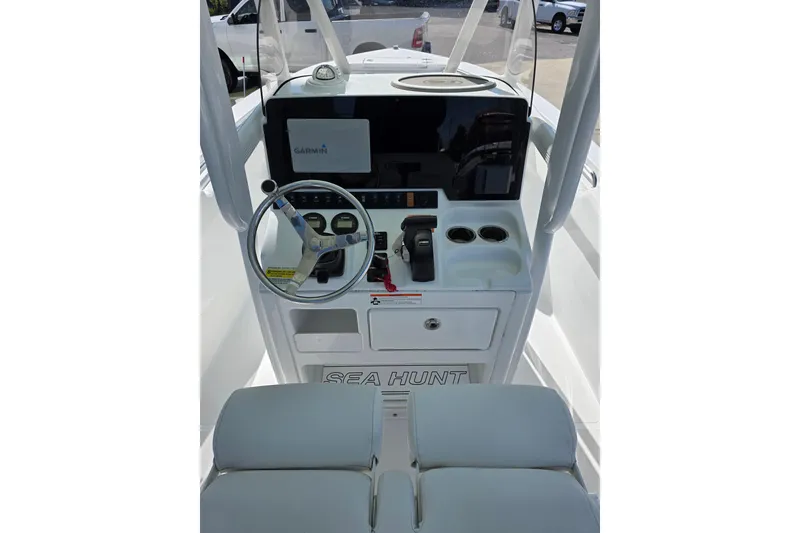 Slide: The Image of 2019 Sea Hunt Ultra 211 boat console with Garmin display and steering wheel. - 8