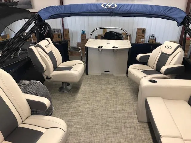 Slide: The Image of 2023 Harris Cruiser 230 interior with plush seating and modern design. - 4