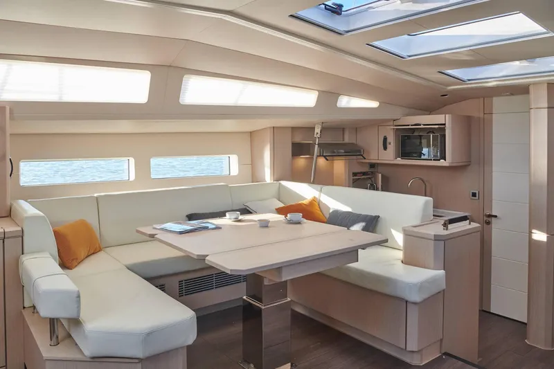 Slide: The Image of Luxurious interior of 2024 Jeanneau 60 yacht with modern seating and skylights. - 20