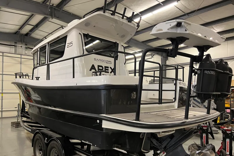 Slide: The Image of 2021 Sargo 25 boat in a warehouse on a trailer. - 10