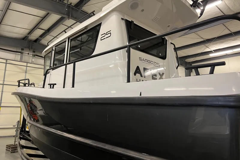 Slide: The Image of 2021 Sargo 25 boat in a warehouse. - 11