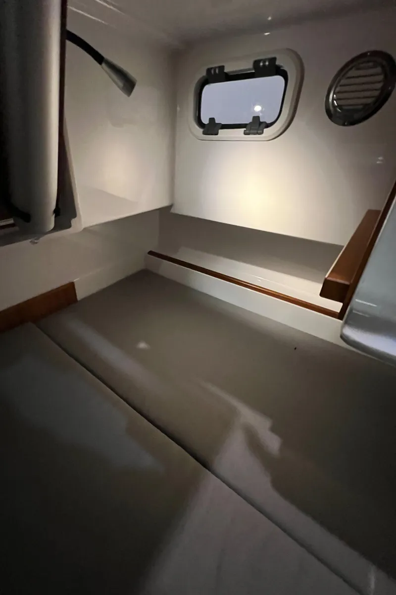 Slide: The Image of Interior cabin of 2021 Sargo 25 boat with window and lighting. - 21