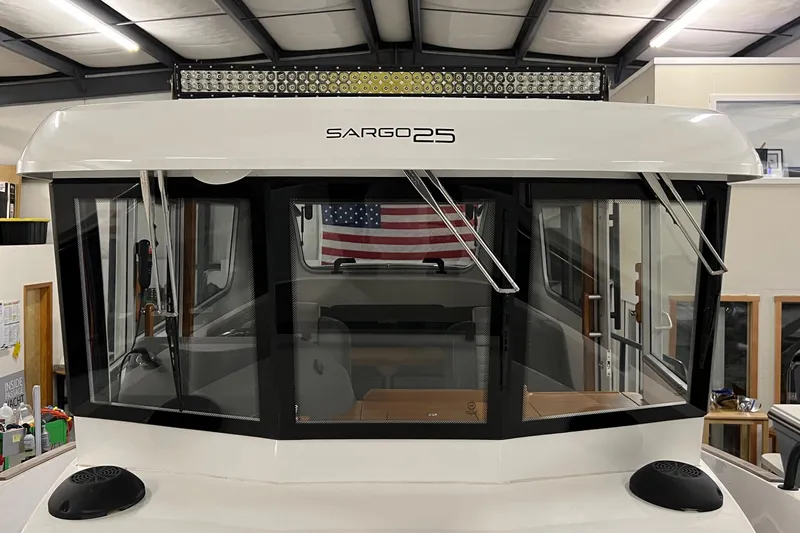 Slide: The Image of 2021 Sargo 25 boat interior with American flag in background. - 31