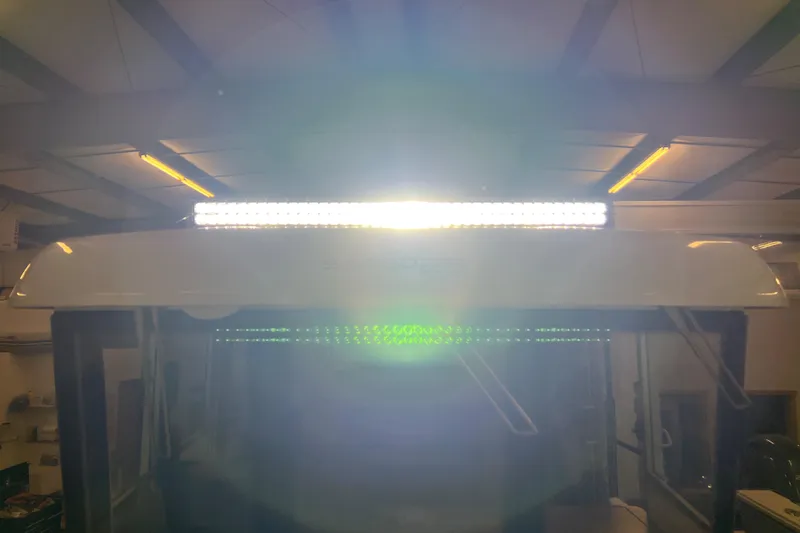 Slide: The Image of Sargo 25 boat 2021 model with bright LED light bar in a garage. - 32