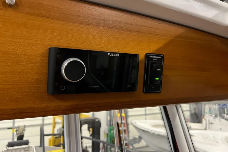 Slide: The Image of Fusion stereo system and control panel in 2021 Sargo 25 boat interior. - 33