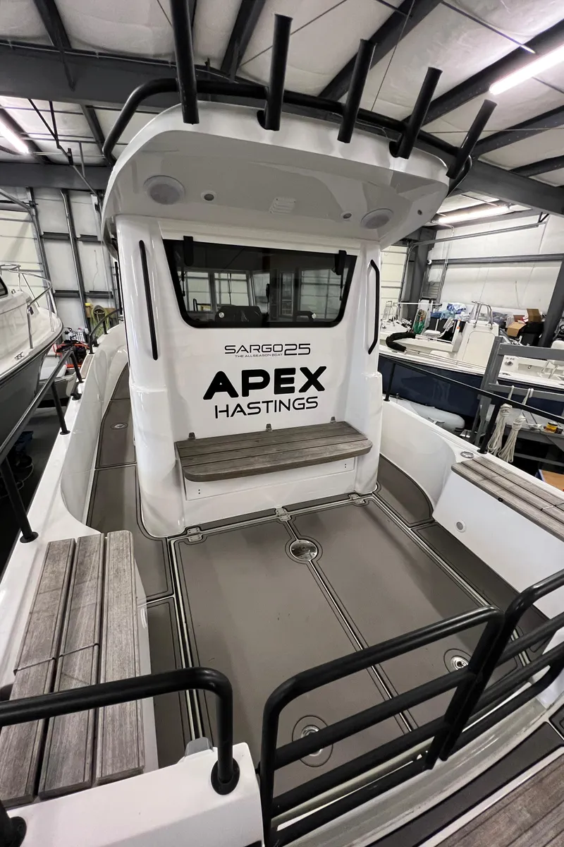 Slide: The Image of 2021 Sargo 25 boat in a warehouse, featuring APEX HASTINGS branding. - 38