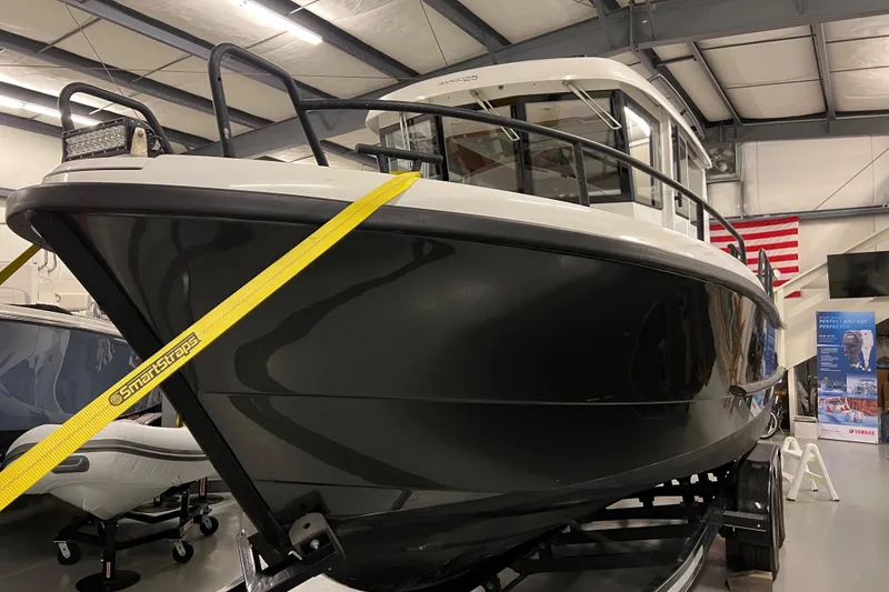 Slide: The Image of 2021 Sargo 25 boat on display in a showroom. - 9