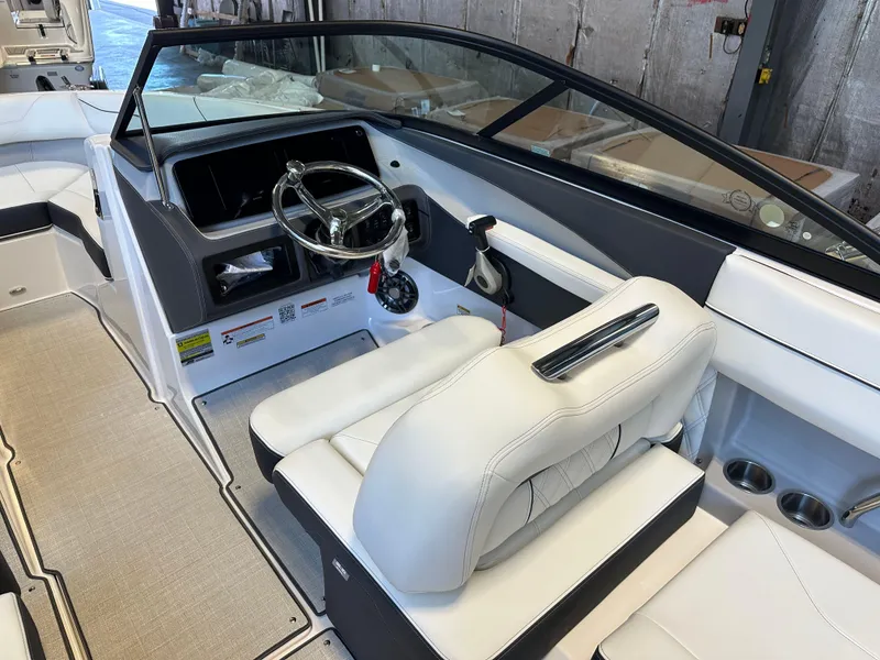 Slide: The Image of 2025 Regal LX2 boat interior with luxurious white seating and sleek design. - 10